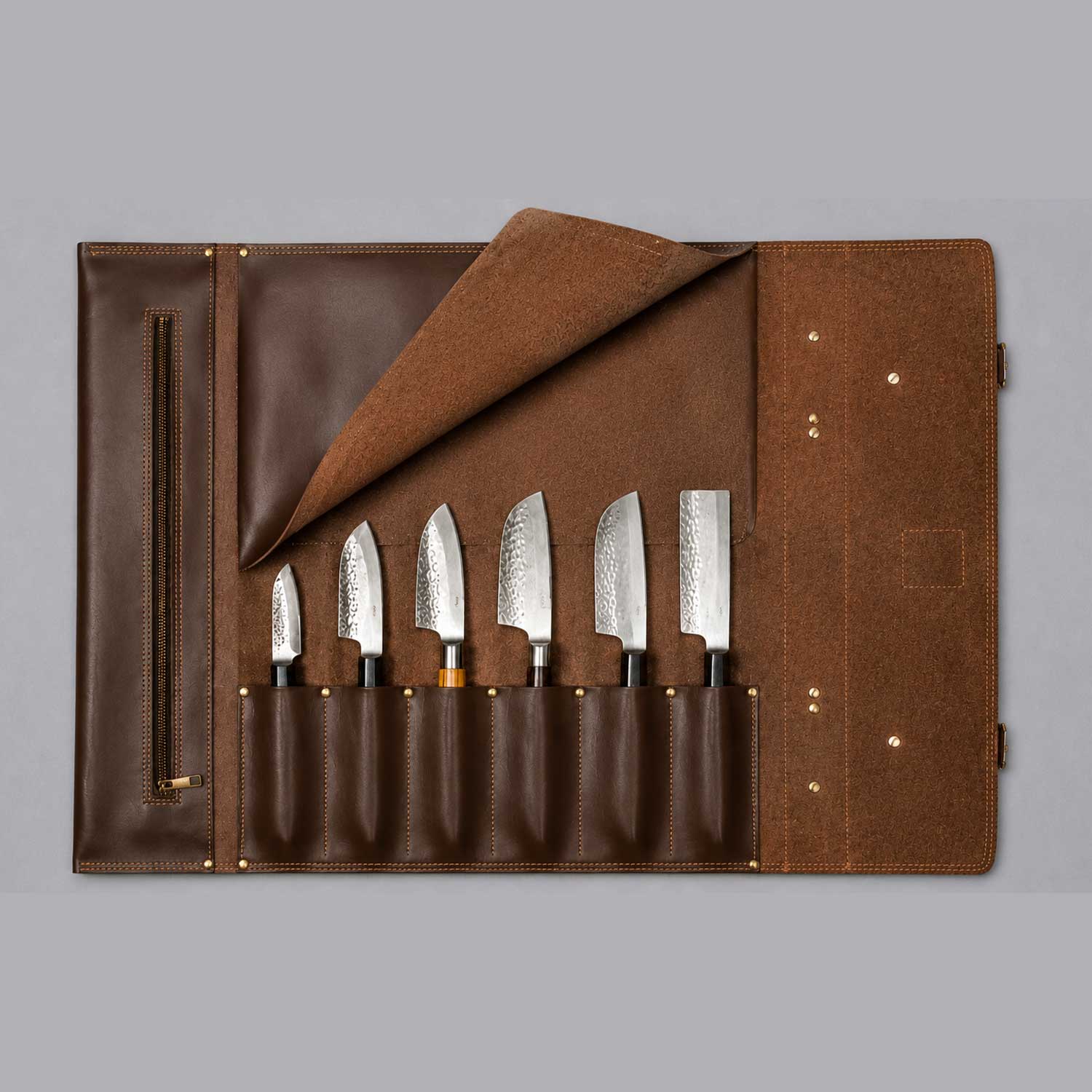Brown full grain cow leather chef knife roll holding 6 knives with shoulder strap and zipper pocket
