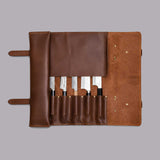 Brown full grain cow leather chef knife roll holding 6 knives with shoulder strap and zipper pocket
