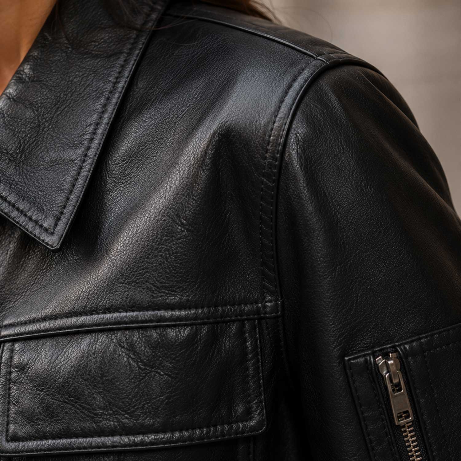 Shoulder seam and stitching craftsmanship detail of The Corvayne leather bomber jacket.